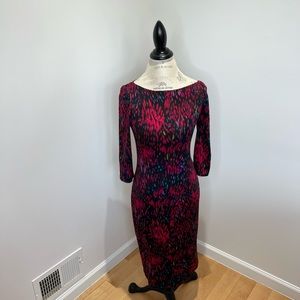 Elegant dress with matching belt. Stunning neck line.